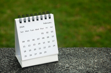 February 2024 table calendar with customizable space for text. Calendar concept and copy space.