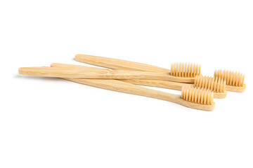 Many bamboo toothbrushes on white background