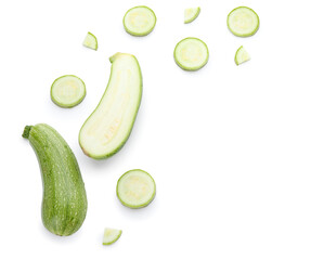 Slices of fresh green zucchini on white background