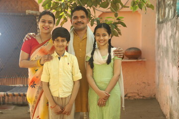 Indian happy farmer family in outdoors. enjoying happy moments of life.