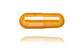 Turmeric capsule isolated on white background.