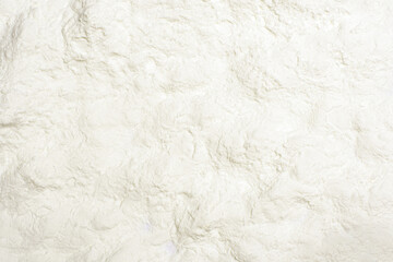 Milk powder or collagen powder texture background. Top view, flat lay.