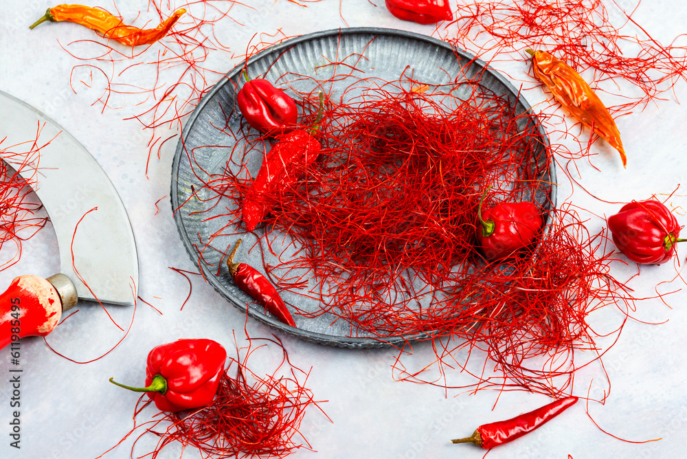 Wall mural cutting red chilly peppers.