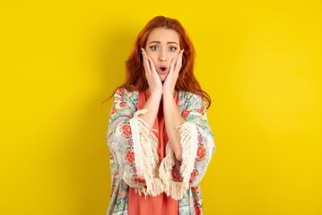 Scared terrified young beautiful red haired woman shocked with prices at shop, People and human...