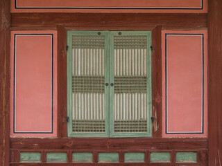 Traditional wooden door with paper window in Gyeongbokgung Palace in seoul