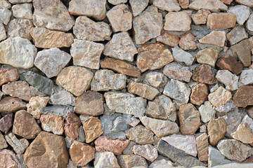 Granite stone wall, pattern of natural gray granite stone wall for background.