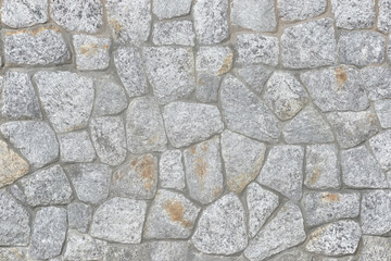 Granite stone wall, pattern of natural gray granite stone wall for background.
