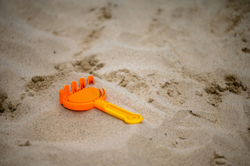 Fototapeta na wymiar Toy in the sand