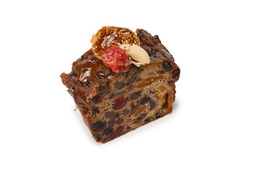 A cake with dried fruits, raisins almonds, dried strawberry.