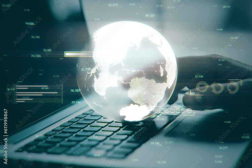 Poster close up of hand using laptop keyboard with creative glowing map or globe hologram on blurry workpla