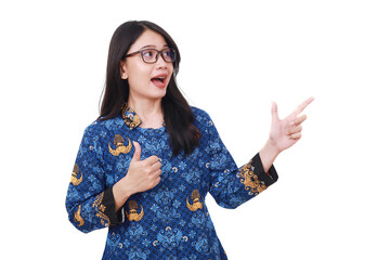 Surprised Asian female in batik korpri, indonesian traditional uniform pointing sideways