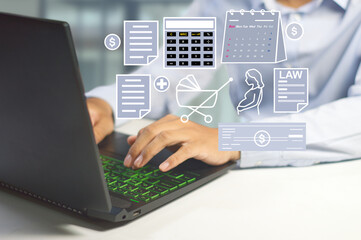 HR officer working on a laptop with employee data manages payroll. health insurance, attendance,...