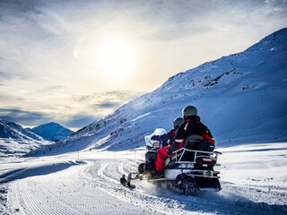 Snowmobile on a trail in the Italian alps