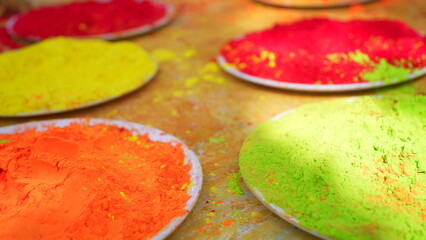 Colorful traditional holi powder in bowls. Happy holi. Concept Indian color festival called Holi. Organic Gulal dust