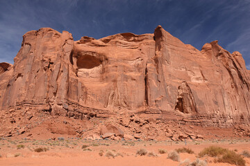 Fototapeta premium Amazing red rock formations in the Monument Valley, Navajo Tribal Park, Utah, USA. Dry dessert landscape