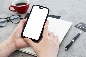 Top view of freelance Asian lady casual using laptop online shopping with credit card on table in living room at house. Working from home, remotely work, flat lay copy space top view
