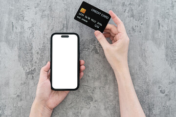 Close up of women's hands holding cell telephone and credit card with blank copy space screen for your advertising text message or promotional content, shopping online.