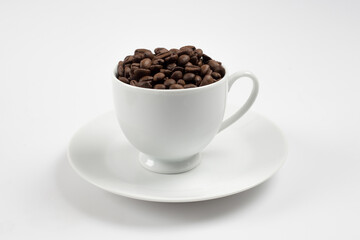 Coffee beans in white glass, white background