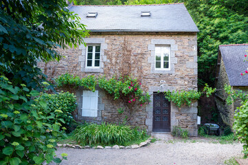 Typical Breton house, Pont-Aven, Brittany, France. Small Breton granite house. The window frames are made of fine cut stone.