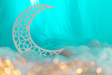 Crescent moon shape isolated on blue background, Eid Al Adha and Ramadan Mubarak design