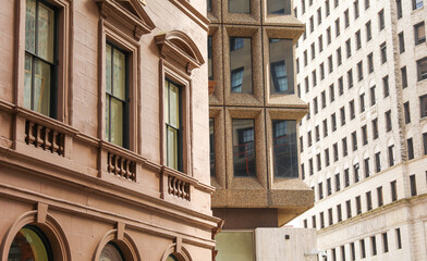 modern structures, with their expansive windows, stand tall beside the weathered beauty of older...