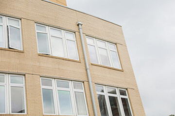 modern structures, with their expansive windows, stand tall beside the weathered beauty of older buildings, symbolizing the intersection of tradition and progress