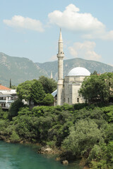 Old mosque on the river bank in Mostar in Bosnia and Hercegovina 