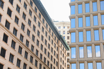 modern structures, with their expansive windows, stand tall beside the weathered beauty of older buildings, symbolizing the intersection of tradition and progress