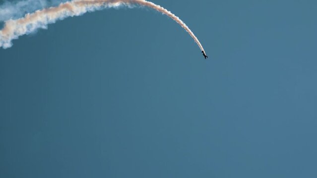 Private plane crash. A small plane during an aerobatic simulation. Airplane engine failure, white smoke coming out of the engine as the plane crashes. Aircraft engine failure. Airplane accidents.