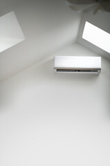 Domestic air conditioning. Air conditioning splitter on the wall. The interior of the attic. Copy...