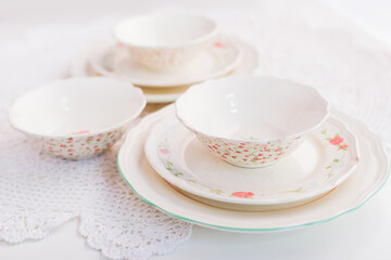 Closeup of porcelain plates and bowls
