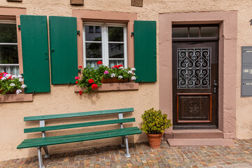 Fototapeta na wymiar Bench and an old house in Schiltach village, Baden-Wurttemberg state, Germany