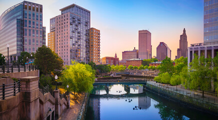 Providence Rhode Island downtown skyline, buildings, tranquil sunrise cityscape, and water reflections on the river 