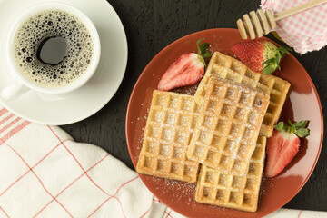 Fresh waffles on the table, freshly baked Belgian waffles