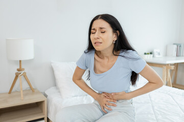 woman hand touching abdomen having stomach ache, female eating food poisoning causes flatulence,...