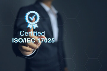 A businessman pointing on certified mark of ISO IEC 17025, which is the standard of international...
