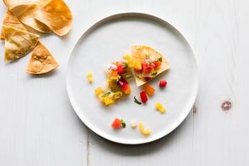Crispy tortilla chips topped with fresh homemade salsa.
