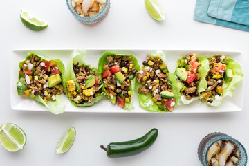 A platter of ground turkey taco lettuce wraps, ready for serving. - obrazy, fototapety, plakaty