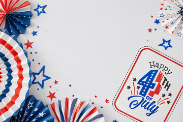 Concept of July 4th jubilation. Top view flat lay of paper fans in national colors, paper props, stars on white background with blank space for text or promo