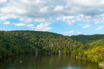 Panorama of a natural body of water in a forest landscape. Brno Reservoir - Czech Republic.
