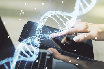 Creative DNA sketch and hand working with a digital tablet on background, biotechnology and genetic...