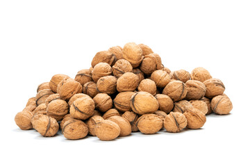 Heap of unpeeled nuts over white background