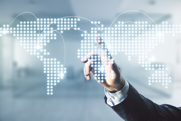 Man hand working with abstract virtual world map with connections on blurred office background, international trading concept. Multiexposure