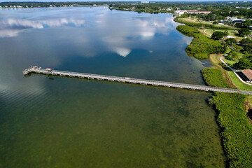 A drone photo of RE Olds city park in Tampa Bay, Florida. An aerial view of the fishing pier.
