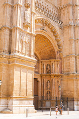 tourists on front of the historical palma cathedral front entrance © Riina