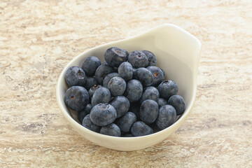 Sweet ripe blueberry heap in the bowl