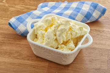 Italian soft mascarpone cheese in the bowl