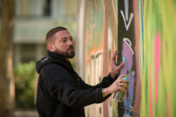 view of an artist doing street art in Paris