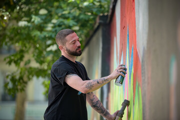 view of an artist doing street art in Paris