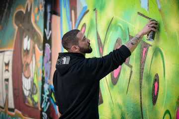 view of an artist doing street art in Paris